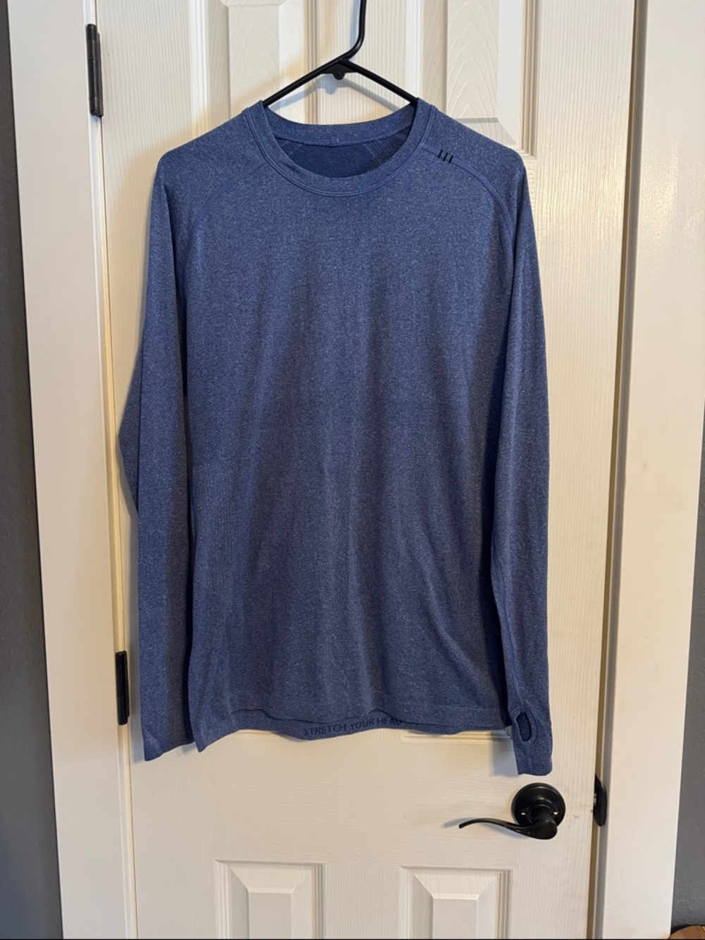 Men’s Lululemon long sleeve base layer workout shirt in size medium.